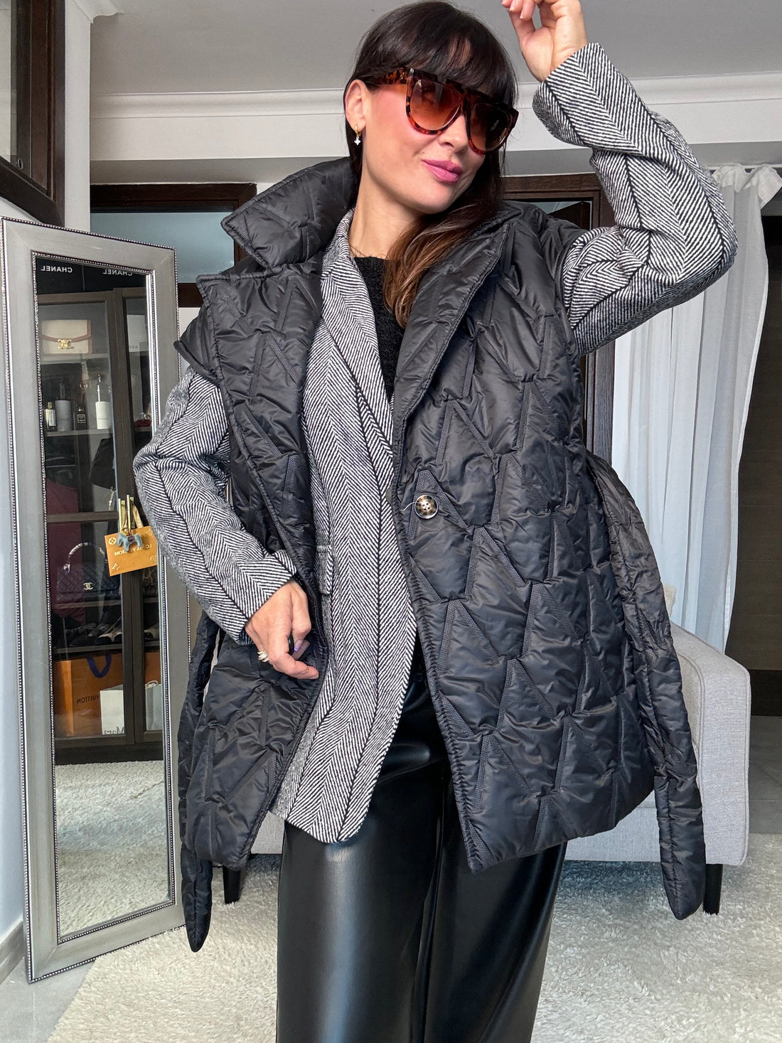 Piumino smanicato nero